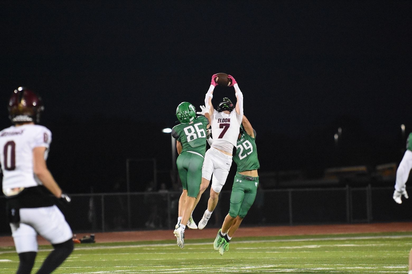 Eldon receiver hauls in a contested catch under the Friday night lights